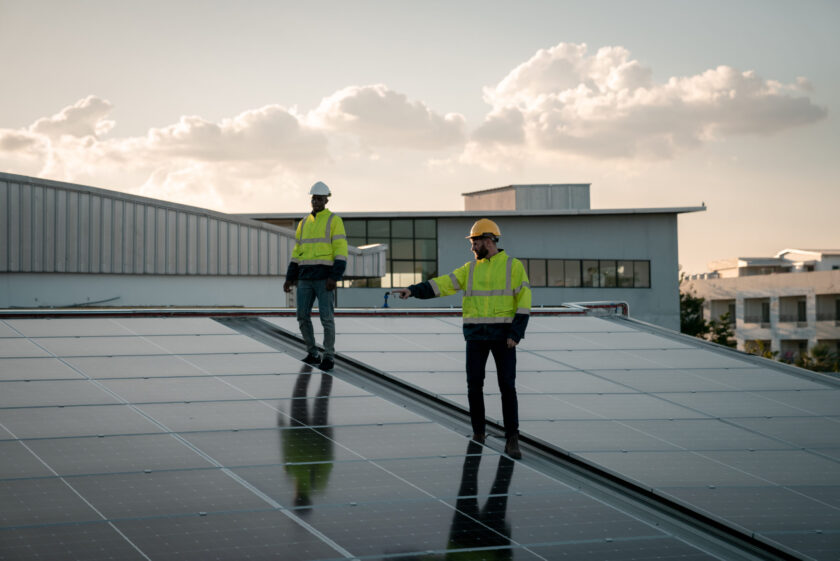 Service engineer checking solar cell on the roof for maintenance if there is a damaged part. Engineer worker install solar panel. Clean energy concept.