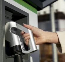 person-taking-care-electric-car